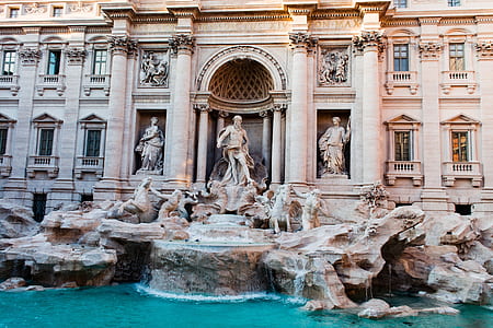 statues in front of building thumbnail