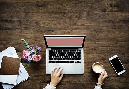 flatlay photo of MacBook Pro beside ceramic mug and iPhone 6 thumbnail