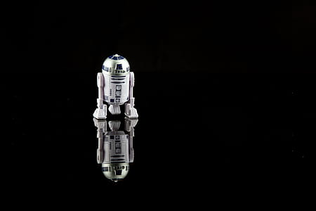 Star Wars R2-D2 toy reflecting on black surface thumbnail