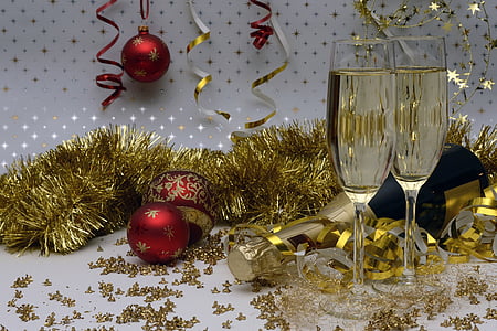 three red baobles beside champagne flutes thumbnail
