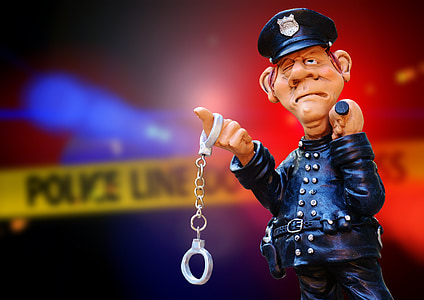 selective focus photography of policeman figurine thumbnail