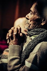 shallow focus photography of man praying thumbnail