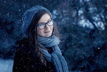 woman standing under snow thumbnail