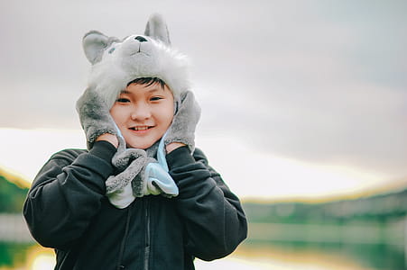 Boy Wearing Gray Dog Critter Hat thumbnail