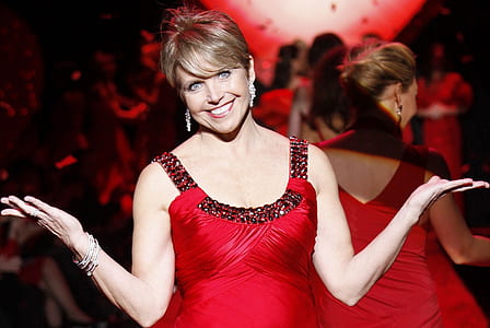 smiling woman standing on modeling ramp thumbnail