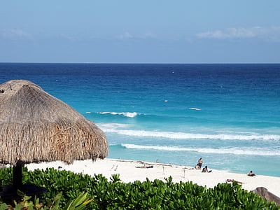 beige hut near beach thumbnail