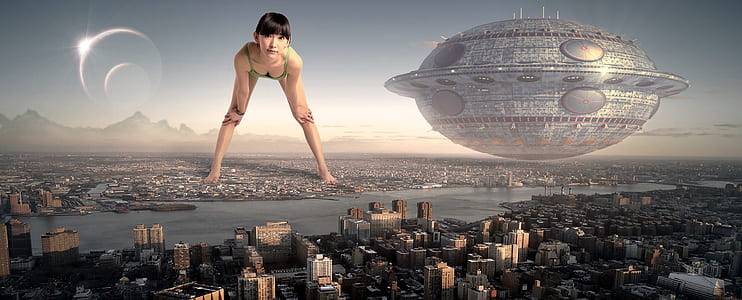 woman standing on city beside mothership wallpaper thumbnail
