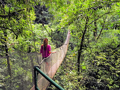 woman standing on hanging bridge thumbnail