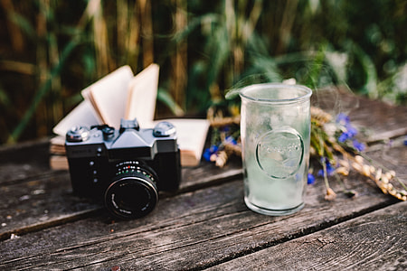 Colorful smoke bomb, book and vintage camera thumbnail