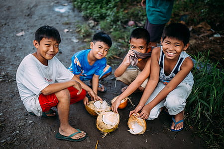 Four Boys Holding Coconut Shell thumbnail