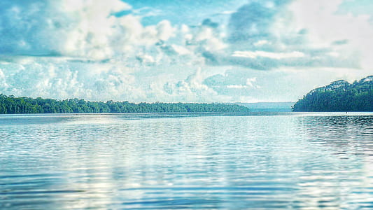 Calm Lake Under Cloudy Sky thumbnail