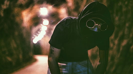 selective focus photography of a man inside tunnel thumbnail