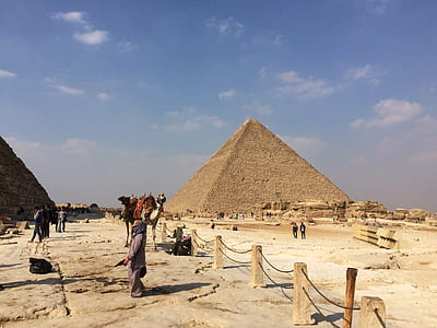 person standing near pyramid of Giza at daytime thumbnail