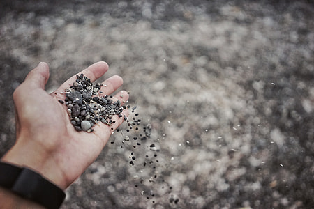 person holding gravel thumbnail