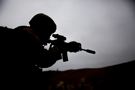 soldier holding assault rifle thumbnail