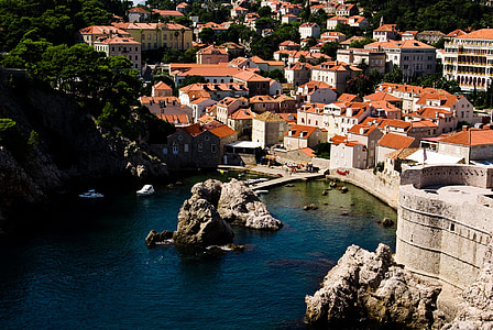 birds eye-view photography of houses near body of water thumbnail