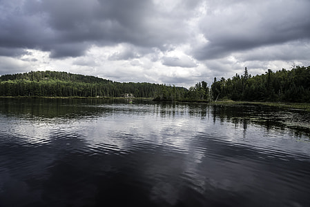 Shoreline, lake, and clouds in Algonquin Provincial Park, Ontario thumbnail