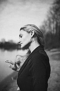 woman holding her hair thumbnail