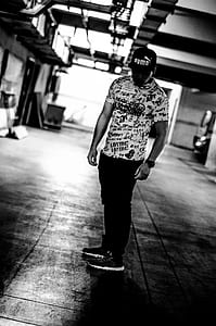 man wearing Puma flat-brimmed cap thumbnail