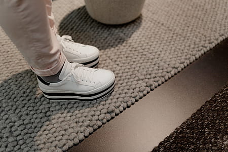A woman in white flatform sneakers thumbnail