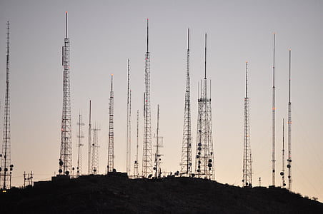 photo of antenna towers during sunset thumbnail