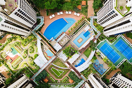 birds eye view of swimming pool between buildings thumbnail