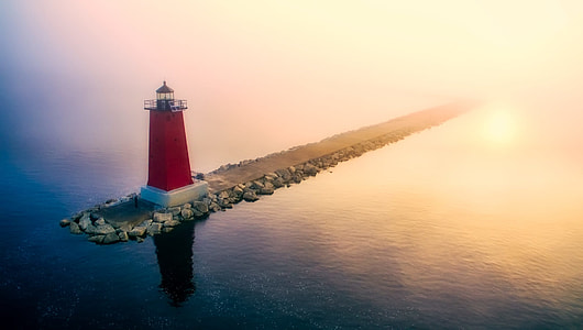 red and white lighthouse during sunset thumbnail