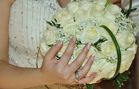 woman holding white rose flower bouquet thumbnail