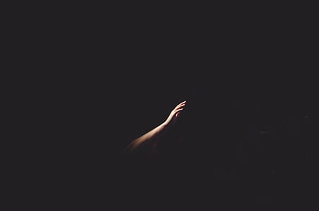 photography of hand with black background thumbnail