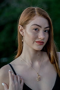 Close-up Photography Of Woman Wearing Gold Necklace thumbnail