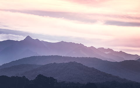 gray hills under cloudy sky thumbnail