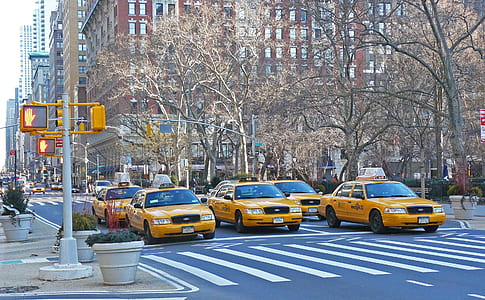 yellow sedan on asphalt road thumbnail