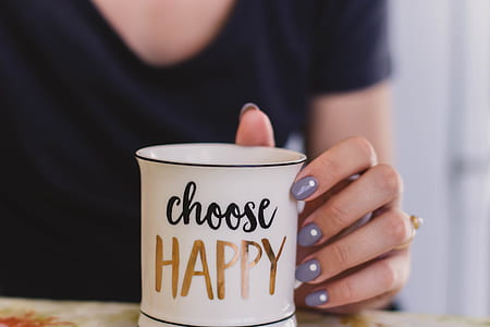 Selective Focus Photography of Person Touch the White Ceramic Mug With Choose Happy Graphic thumbnail
