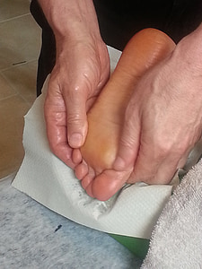 person massaging foot thumbnail