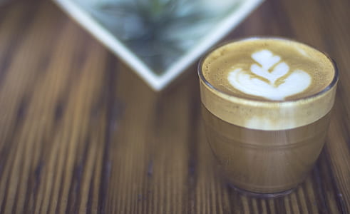 cappuccino on brown wooden board thumbnail