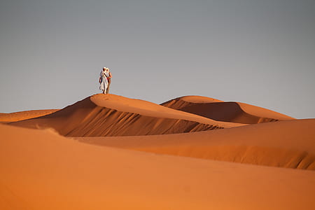 two person in desert during daytime thumbnail