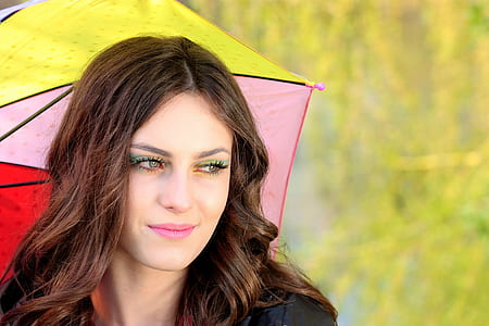 woman with pink, yellow, and red umbrella thumbnail