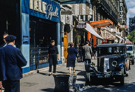 people walking beside store front during daytime thumbnail