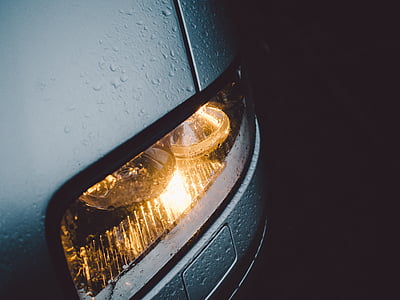 turned-on vehicle headlight thumbnail
