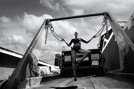 Photo of Bald Woman Holding Two Chains thumbnail