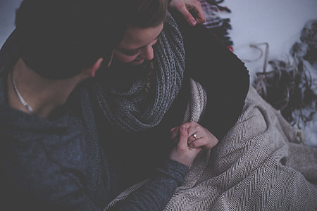 man holding woman's left arm thumbnail