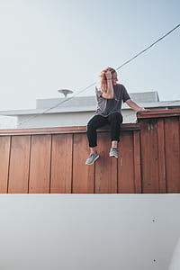 person sitting on fence thumbnail