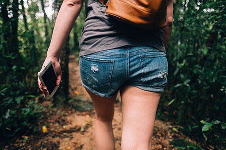 close up of human wearing shorts walking hallway thumbnail