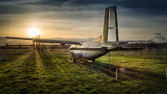 plane on grass field thumbnail