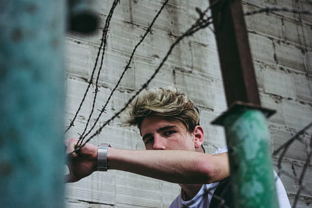 man holding barbwire thumbnail