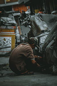 shallow focus photography of man in brown polo shirt thumbnail
