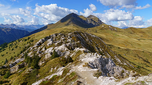 aerial photography of mountain range under cumulus clouds thumbnail