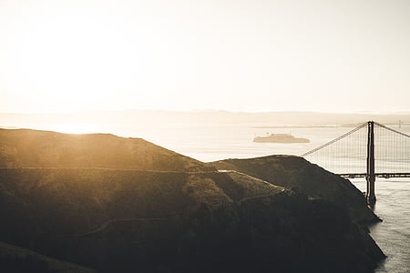 in distant bridge above blue ocean thumbnail