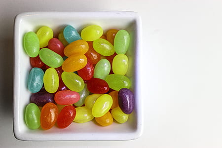 bean candies on white ceramic bowl thumbnail