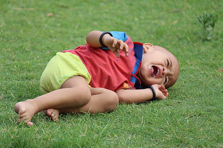 baby lying on grass thumbnail